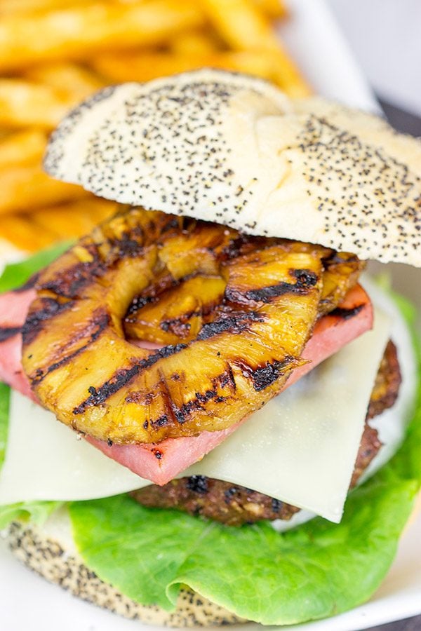 Piled high with teriyaki pineapples and grilled ham, this Grilled Aloha Burger deserves a spot on your dinner menu!