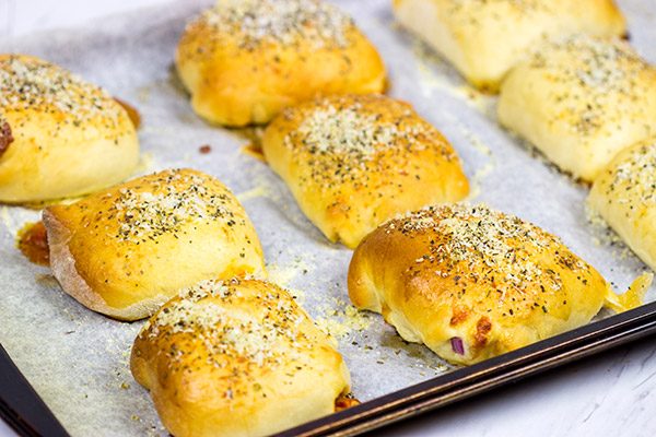 Who says pizza needs to be served by the slice? These Stuffed Pepperoni Pizza Rolls are a tasty twist on a classic!