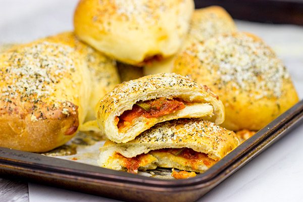 Who says pizza needs to be served by the slice? These Stuffed Pepperoni Pizza Rolls are a tasty twist on a classic!