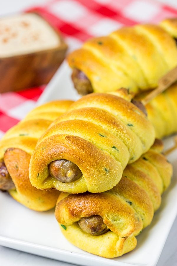 Take this street food to a whole new level with these Baked Cheddar Brat Corndogs!