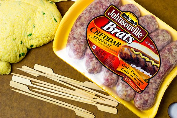 Take this street food to a whole new level with these Baked Cheddar Brat Corndogs!