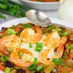 These Charleston Shrimp and Grits feature a bed of creamy grits topped with flavorful shrimp and Andouille sausage!