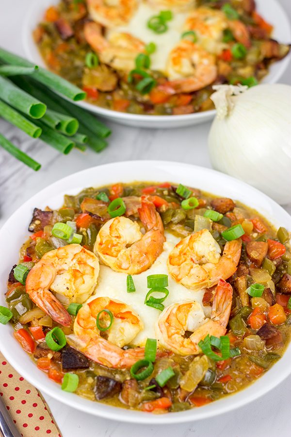 These Charleston Shrimp and Grits feature a bed of creamy grits topped with flavorful shrimp and Andouille sausage!