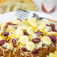Chili served over spaghetti? Yup, it's the Cincinnati way! Whip up a batch of this Slow Cooker Cincinnati Chili for dinner tonight!
