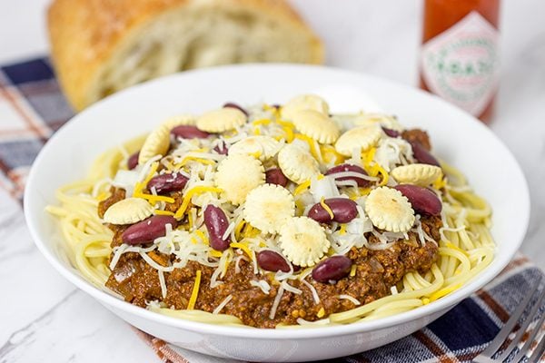 Chili served over spaghetti? Yup, it's the Cincinnati way! Whip up a batch of this Slow Cooker Cincinnati Chili for dinner tonight!