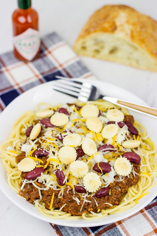Chili served over spaghetti? Yup, it's the Cincinnati way! Whip up a batch of this Slow Cooker Cincinnati Chili for dinner tonight!