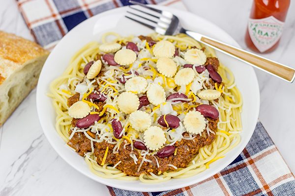 Chili served over spaghetti? Yup, it's the Cincinnati way! Whip up a batch of this Slow Cooker Cincinnati Chili for dinner tonight!