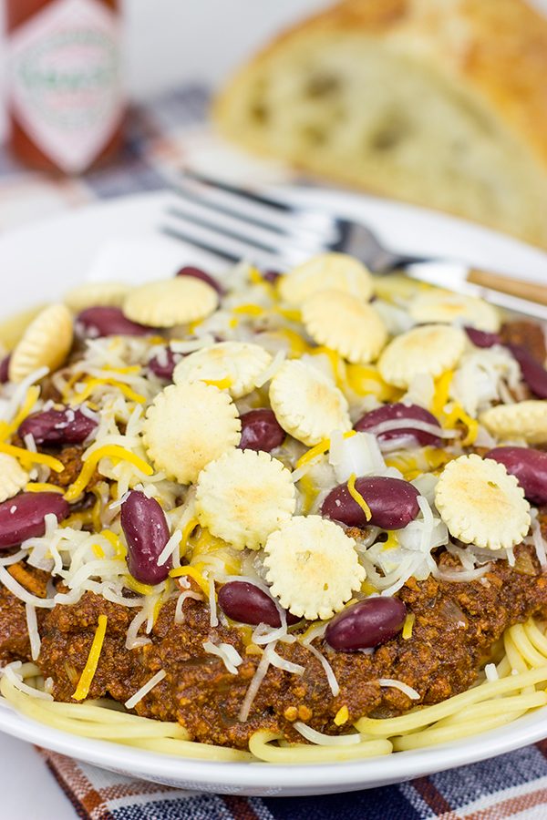 Chili served over spaghetti? Yup, it's the Cincinnati way! Whip up a batch of this Slow Cooker Cincinnati Chili for dinner tonight!