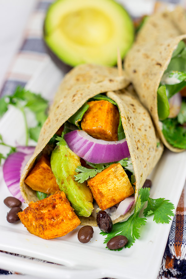 These Southwestern Veggie Wraps are packed with layers of flavor...starting with seasoned sweet potatoes!
