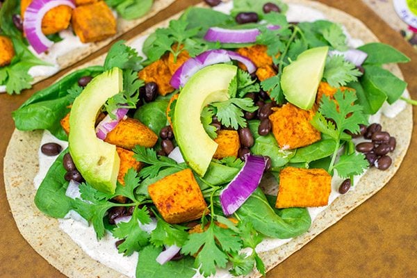 These Southwestern Veggie Wraps are packed with layers of flavor...starting with seasoned sweet potatoes!