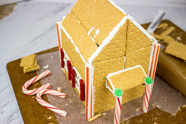 Have you ever made a Holiday Gingerbread House? Here are some tips and tricks for this classic Christmas activity!