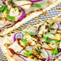 Want to surprise your family with a delicious dinner? Try whipping up a batch of these BBQ Chicken Flatbread Pizzas!