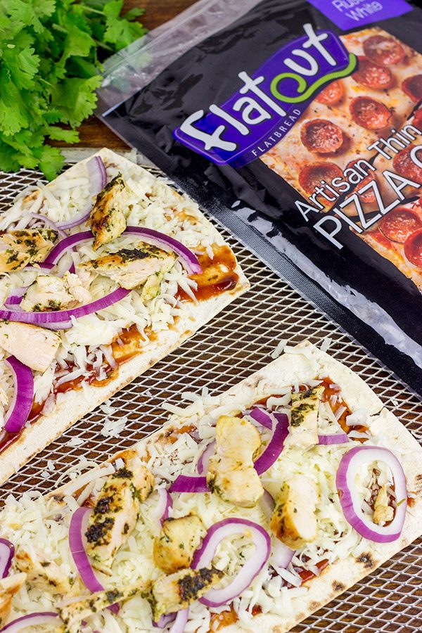 Want to surprise your family with a delicious dinner? Try whipping up a batch of these BBQ Chicken Flatbread Pizzas!