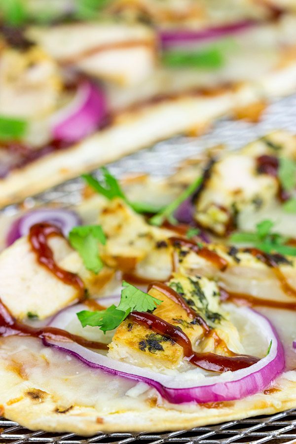 Want to surprise your family with a delicious dinner? Try whipping up a batch of these BBQ Chicken Flatbread Pizzas!