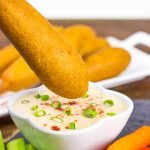 Food on a stick always tastes better! These Corndogs with Creamy Honey Buffalo Sauce are quite tasty!