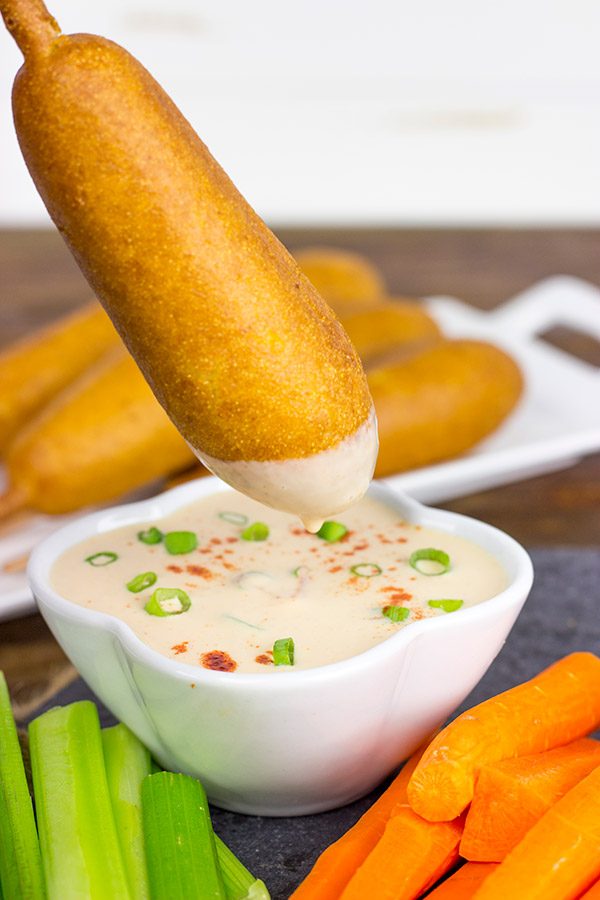 Food on a stick always tastes better! These Corndogs with Creamy Honey Buffalo Sauce are quite tasty!