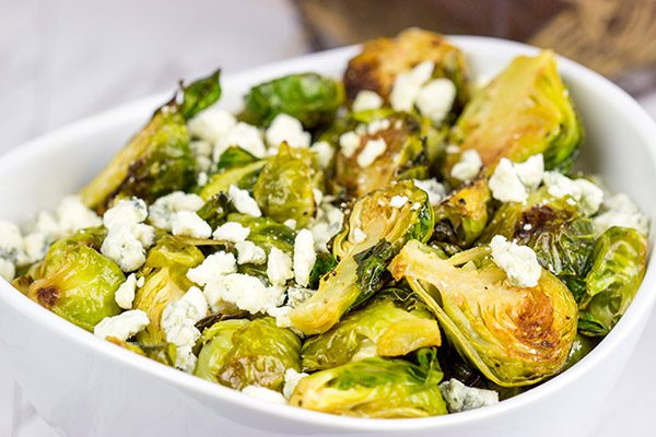 Buffalo sauce on oven-roasted veggies? Yup! These Roasted Buffalo Brussels Sprouts are delicious!