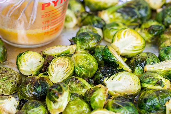 Buffalo sauce on oven-roasted veggies? Yup! These Roasted Buffalo Brussels Sprouts are delicious!