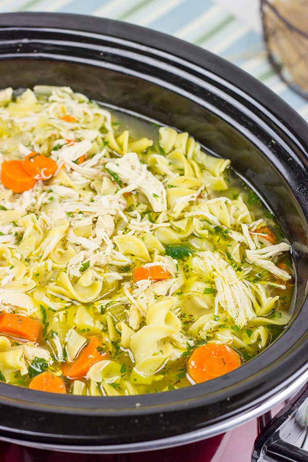 This Slow Cooker Chicken Noodle Soup is perfect for cold winter days when you just want to curl up on the couch with a good book!