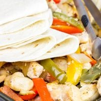 These Sheet Pan Chicken Fajitas are an easy and flavorful dinner...and clean-up is a breeze! This one is perfect for dinner on a busy weeknight!