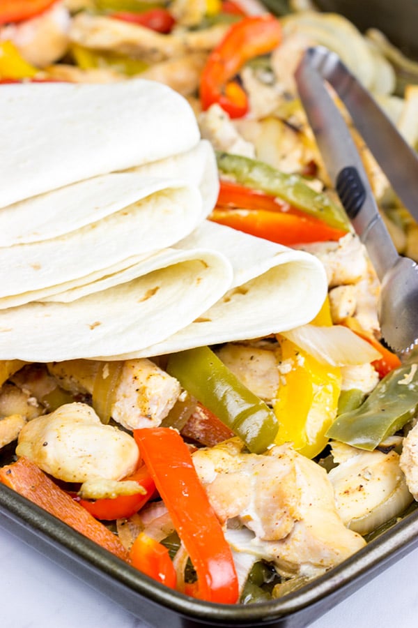 These Sheet Pan Chicken Fajitas are an easy and flavorful dinner...and clean-up is a breeze! This one is perfect for dinner on a busy weeknight!