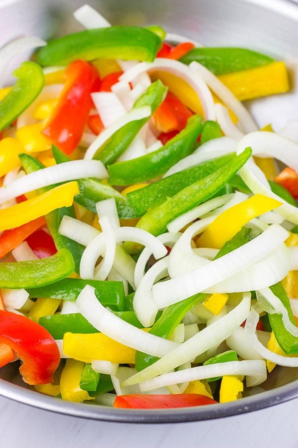 These Sheet Pan Chicken Fajitas are an easy and flavorful dinner...and clean-up is a breeze! This one is perfect for dinner on a busy weeknight!
