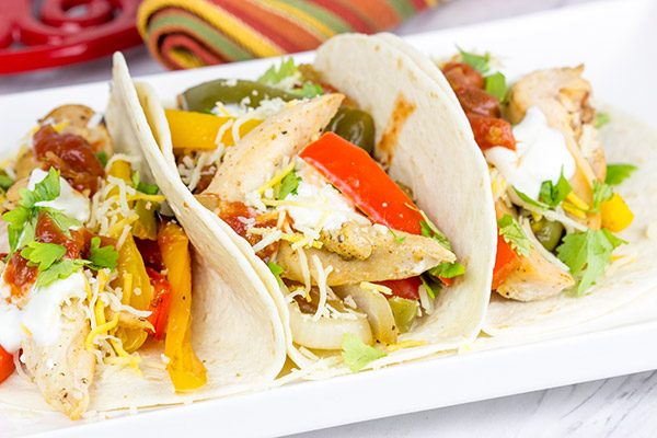 These Sheet Pan Chicken Fajitas are an easy and flavorful dinner...and clean-up is a breeze! This one is perfect for dinner on a busy weeknight!