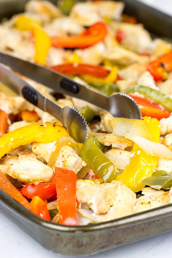 These Sheet Pan Chicken Fajitas are an easy and flavorful dinner...and clean-up is a breeze! This one is perfect for dinner on a busy weeknight!