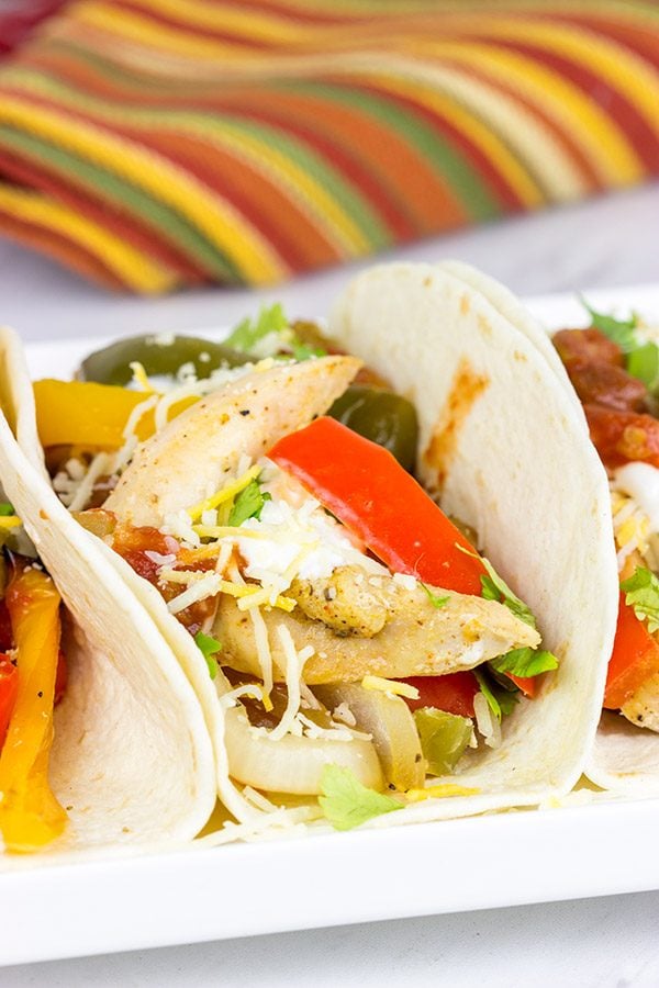 These Sheet Pan Chicken Fajitas are an easy and flavorful dinner...and clean-up is a breeze! This one is perfect for dinner on a busy weeknight!