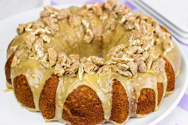 This Pecan Praline Bundt Cake features a warm praline frosting poured over a moist cake. Oh, and there's some sugared pecans in there, too! Enjoy!