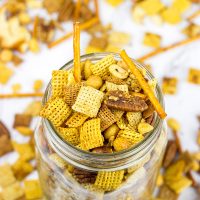 Craving a good snack for this weekend? This Slow Cooker Cajun Snack Mix is an easy and tasty treat!