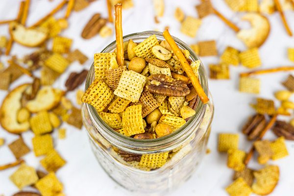 Craving a good snack for this weekend? This Slow Cooker Cajun Snack Mix is an easy and tasty treat!