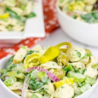 This Smoked Mozzarella Pasta Salad has a secret ingredient: pepperoncini! This recipe is a delicious way to celebrate summer picnic season!
