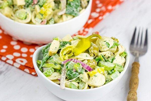 This Smoked Mozzarella Pasta Salad has a secret ingredient: pepperoncini! This recipe is a delicious way to celebrate summer picnic season!