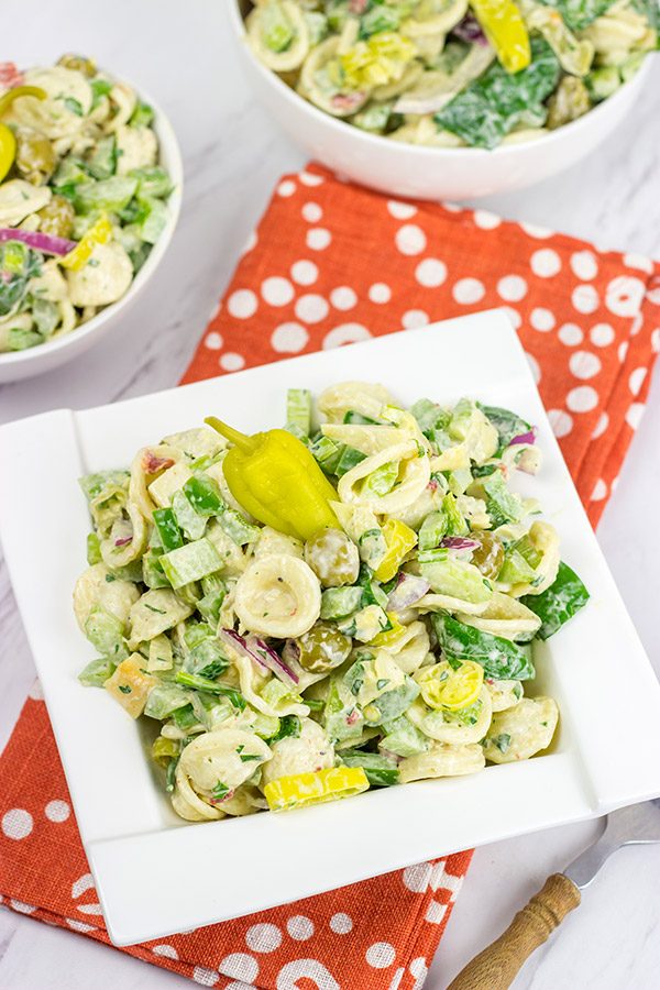 This Smoked Mozzarella Pasta Salad has a secret ingredient: pepperoncini! This recipe is a delicious way to celebrate summer picnic season!