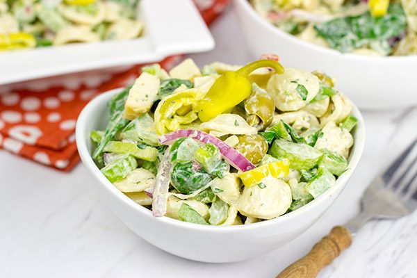 This Smoked Mozzarella Pasta Salad has a secret ingredient: pepperoncini! This recipe is a delicious way to celebrate summer picnic season!