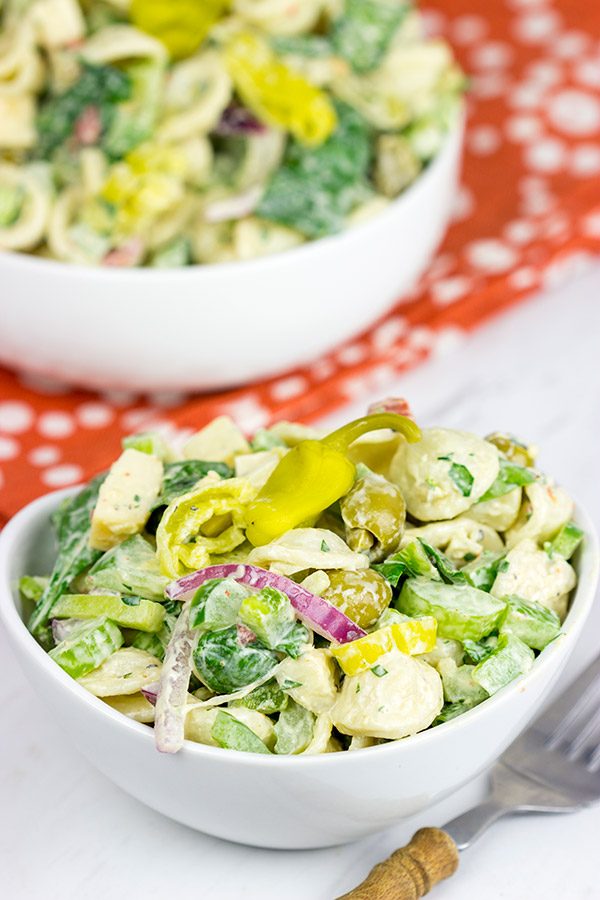 This Smoked Mozzarella Pasta Salad has a secret ingredient: pepperoncini! This recipe is a delicious way to celebrate summer picnic season!
