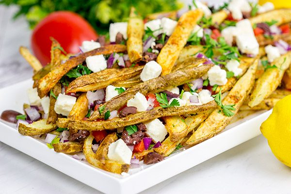 Loaded with feta, tomatoes and olives, these Baked Greek Fries make for one delicious appetizer!
