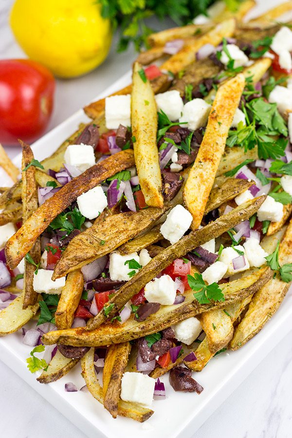 Loaded with feta, tomatoes and olives, these Baked Greek Fries make for one delicious appetizer!