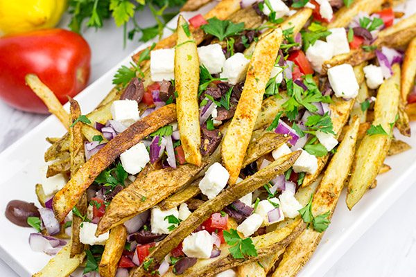 Loaded with feta, tomatoes and olives, these Baked Greek Fries make for one delicious appetizer!