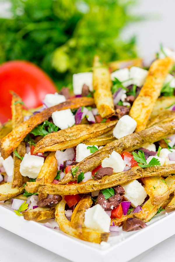 Loaded with feta, tomatoes and olives, these Baked Greek Fries make for one delicious appetizer!
