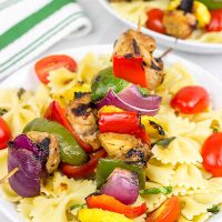 These Grilled Pork Kabobs are served over pasta for a fun and tasty summer meal!