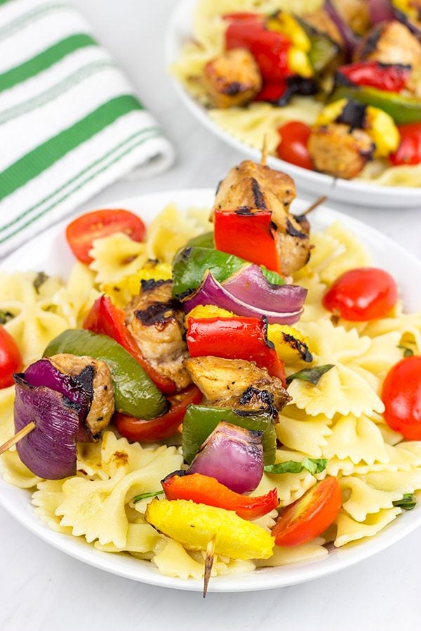 These Grilled Pork Kabobs are served over pasta for a fun and tasty summer meal!