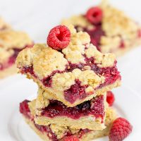 These Raspberry Crumb Bars feature fresh or frozen berries...and they're the perfect fruity dessert for a warm summer day!