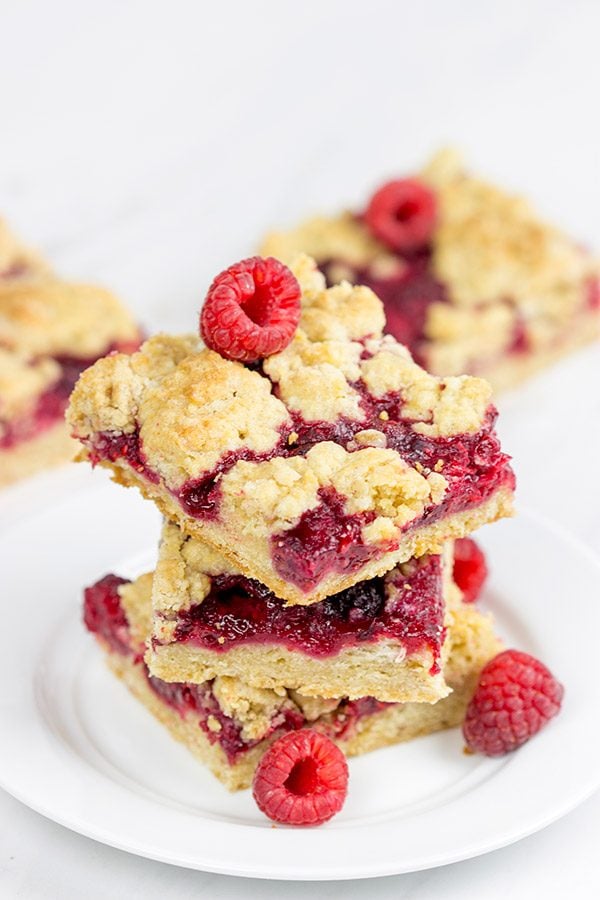These Raspberry Crumb Bars feature fresh or frozen berries...and they're the perfect fruity dessert for a warm summer day!