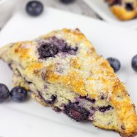 These Classic Blueberry Scones are a cross between a flavorful blueberry muffin and a crumbly buttermilk biscuit. I dare you to eat just one!