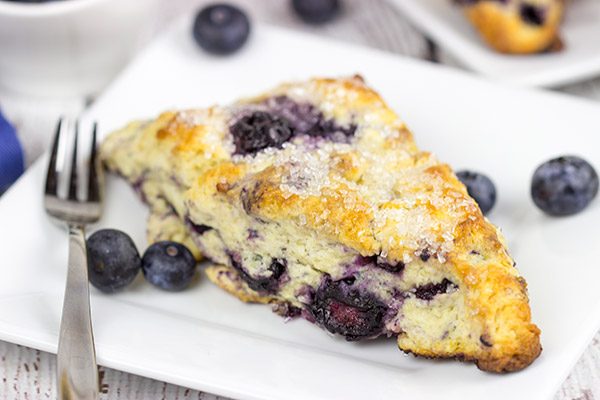 These Classic Blueberry Scones are a cross between a flavorful blueberry muffin and a crumbly buttermilk biscuit. I dare you to eat just one!