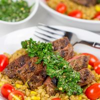 Looking for a delicious summer meal? This Grilled Flank Steak with Porcini Mushroom Pilaf will make you look like a superstar chef!
