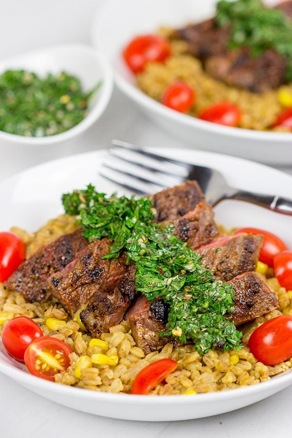 Looking for a delicious summer meal? This Grilled Flank Steak with Porcini Mushroom Pilaf will make you look like a superstar chef!