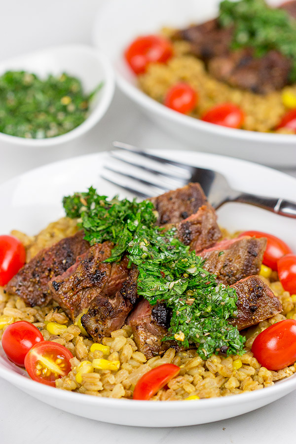 Looking for a delicious summer meal? This Grilled Flank Steak with Porcini Mushroom Pilaf will make you look like a superstar chef!